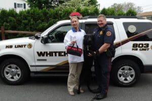 Vet standing next to k-9 police